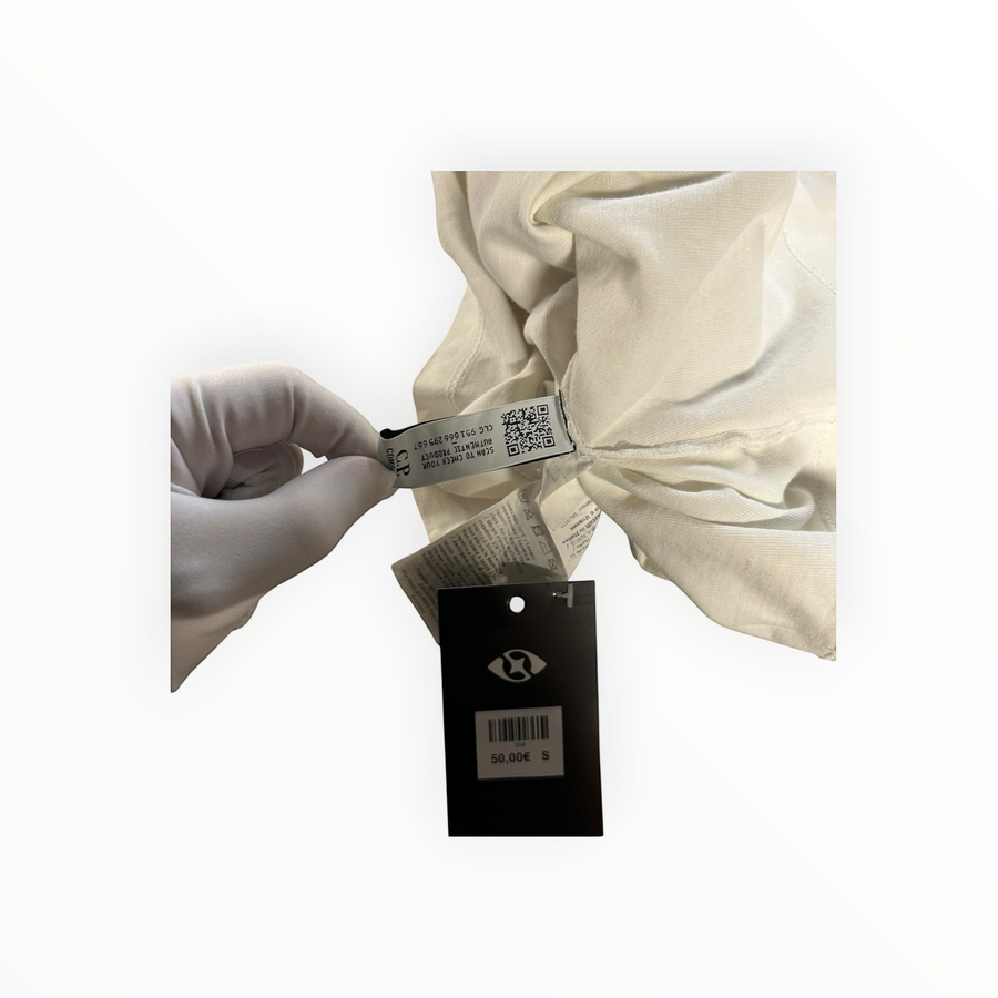 Secondstore C.P. Company off-white cotton t-shirt showing authentic internal care label and price tag