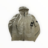 Veste à capuche beige Secondstore C.P. Company en tissu technique Shell-R avec détail de verre signature sur la manche