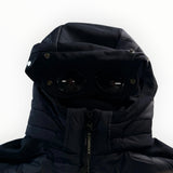 Veste noire Secondstore C.P. Company avec capuche iconique et lunettes intégrées, design hybride technique.