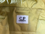 Étiquette intérieure de marque C.P. Company sur une veste technique jaune Secondstore en tissu Pro-Tek