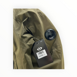 Veste Secondstore C.P. Company kaki en tissu technique Pro-Tek avec lentille emblématique sur la manche