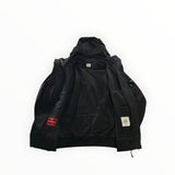 Veste noire Secondstore C.P. Company Shell-R zippée avec capuche, doublure technique et logo lentille sur la manche.
