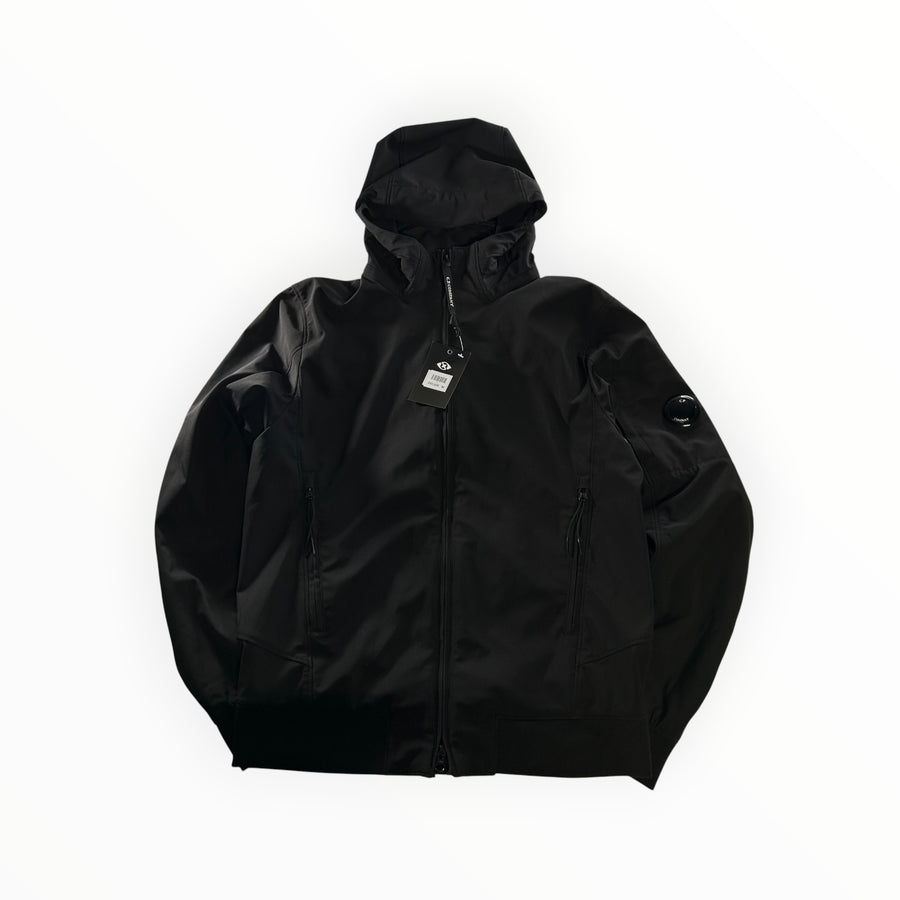 Veste à capuche noire Secondstore C.P. Company Shell-R en nylon recyclé avec lentille emblématique sur la manche.