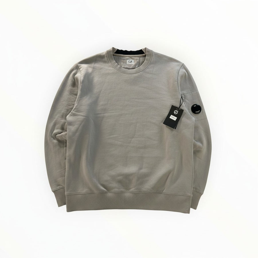Secondstore grey C.P. Company crewneck sweatshirt in cotton with ribbed trim and iconic sleeve lens detail.