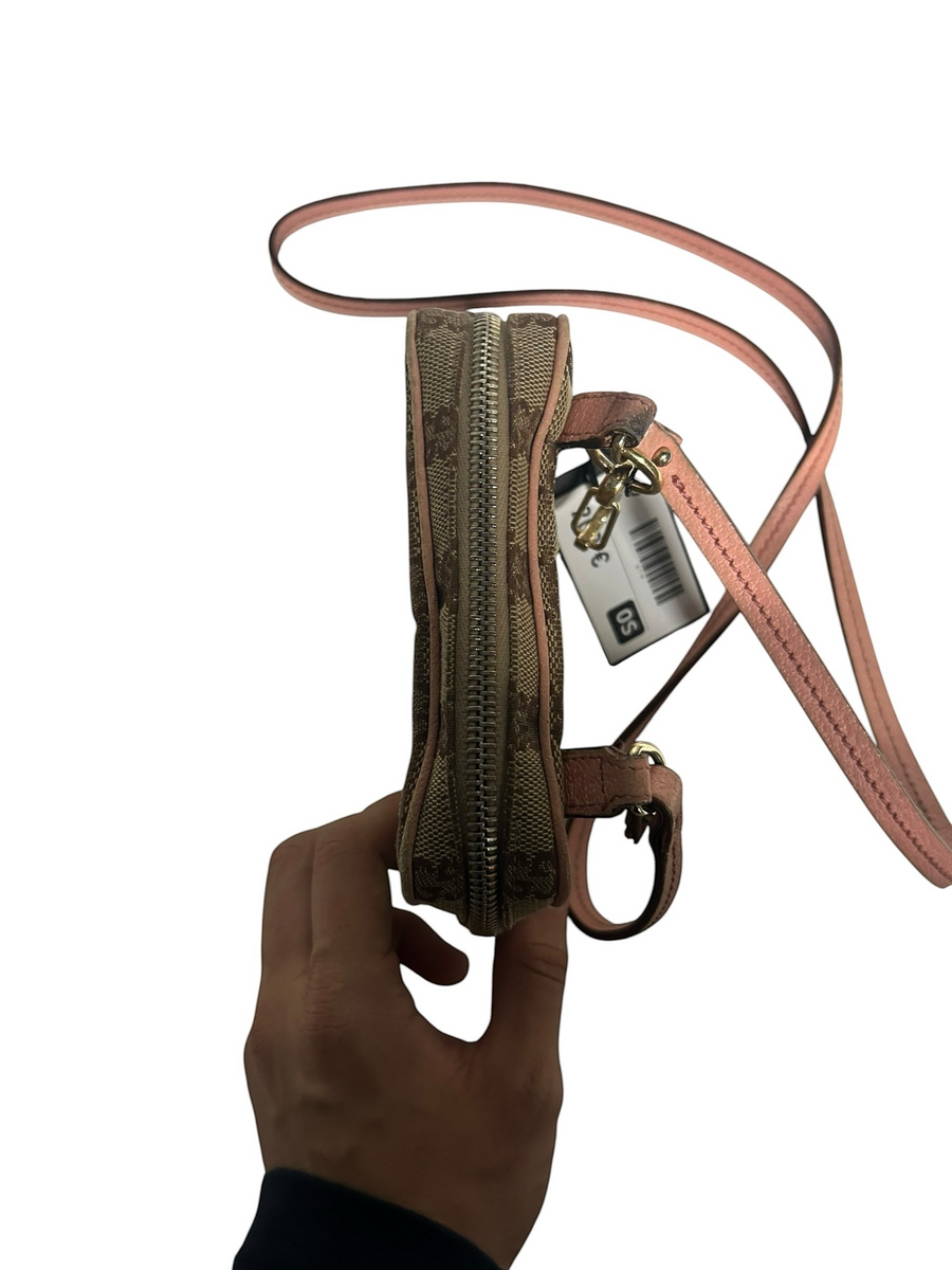 Secondstore Gucci monogram canvas crossbody bag with pink leather trim and adjustable strap, side view.