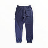 Vue arrière du pantalon de jogging bleu en coton Secondstore Stone Island avec poche arrière et finitions côtelées