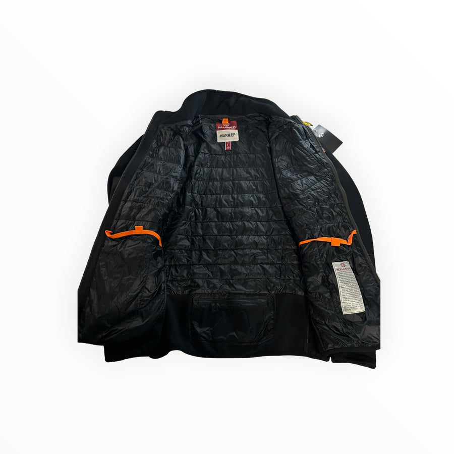 Secondstore PARAJUMPERS hybrid jacket interior with black quilted nylon lining and signature orange trim details.