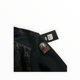 Secondstore Parajumpers hybrid jacket featuring black quilted nylon and textured knit fabric with iconic sleeve patch