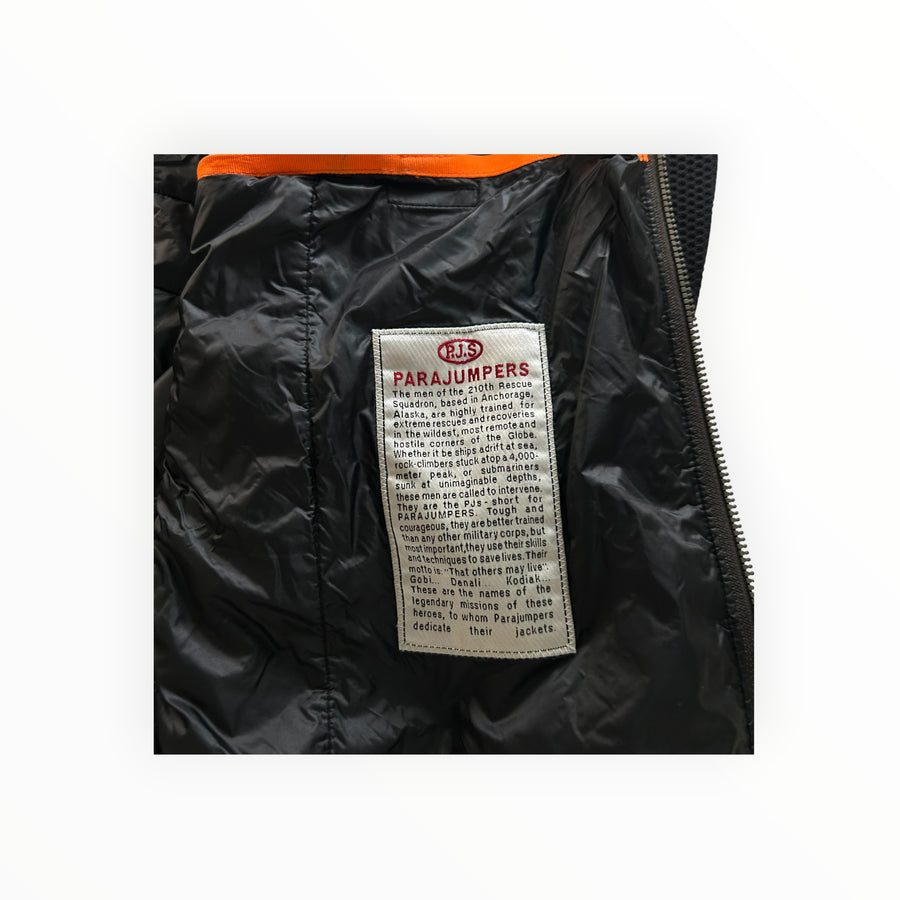 Secondstore PARAJUMPERS hybrid jacket interior featuring the iconic mission statement patch on black quilted nylon