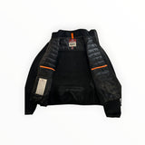 Veste hybride noire Secondstore Parajumpers avec intérieur matelassé, détails orange et col montant technique.