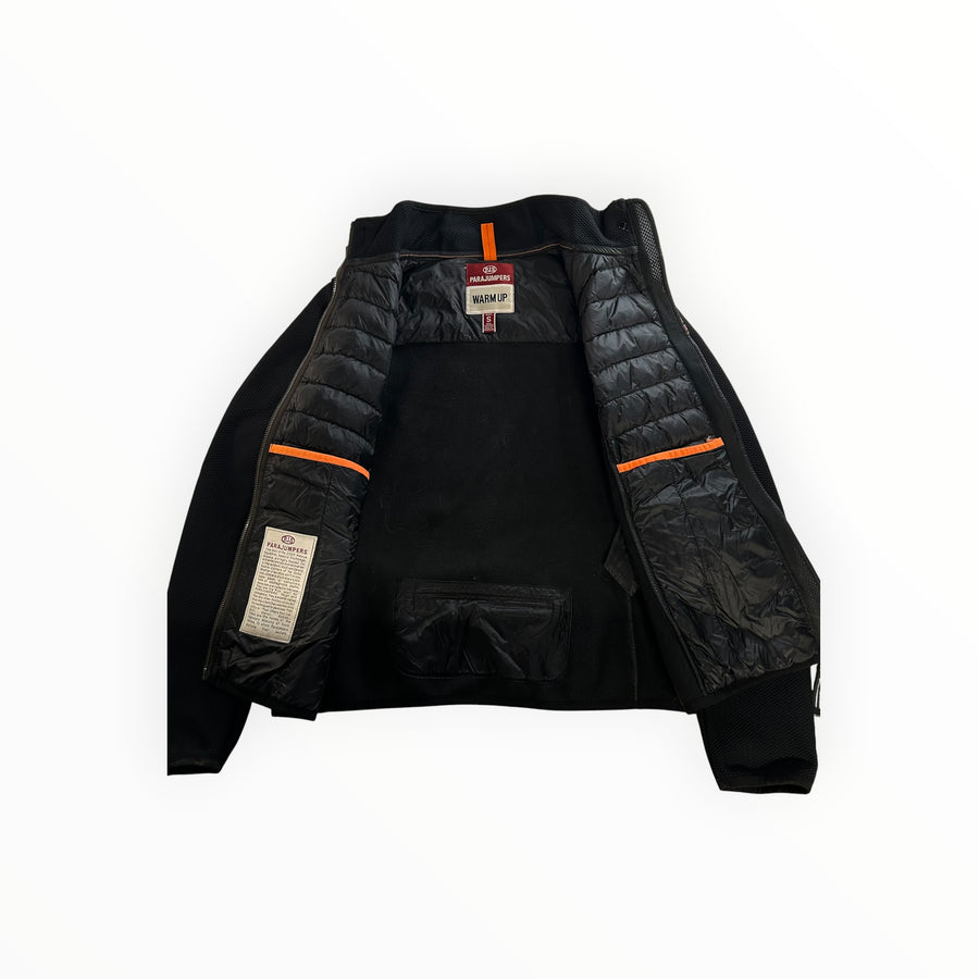 Veste hybride noire Secondstore Parajumpers avec intérieur matelassé, détails orange et col montant technique.