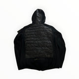 Vue arrière de la veste hybride noire Secondstore Parajumpers avec panneaux matelassés et maille technique.