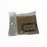 Pochette de protection en toile beige avec logo GUCCI pour casquette, vendue par Secondstore
