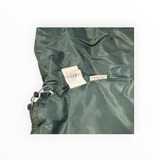 Détail intérieur de la doudoune Secondstore Pyrenex vert profond avec étiquette de duvet français et cordon de serrage