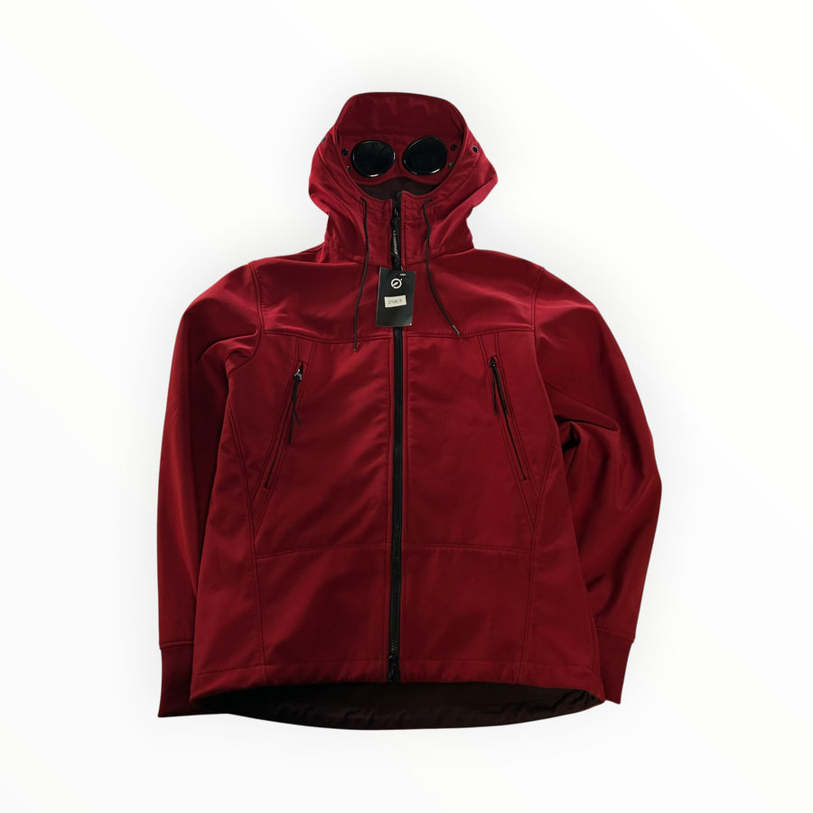 Secondstore red C.P. Company Goggle Jacket in soft-shell fabric with integrated hood goggles and zip pockets.