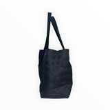 Sac cabas Secondstore Chanel New Travel Line en toile technique noire avec finitions en cuir et anses pour épaule