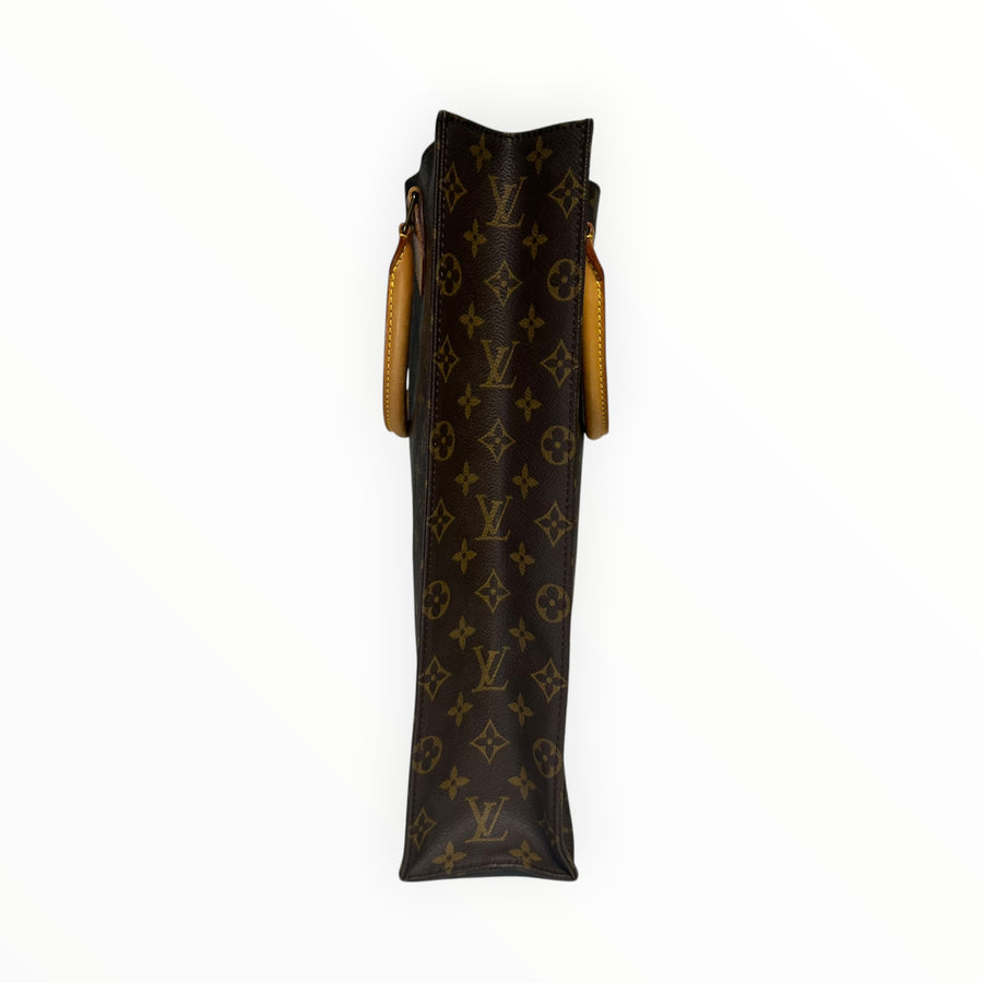 Vue latérale du sac cabas Secondstore Louis Vuitton en toile Monogram marron avec anses en cuir de vachette naturel