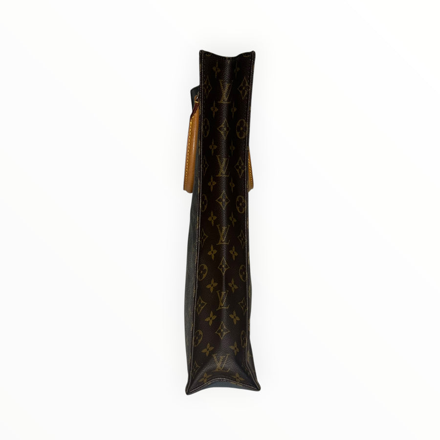Vue latérale du sac cabas Secondstore Louis Vuitton en toile Monogram marron avec anses en cuir de vachette naturel
