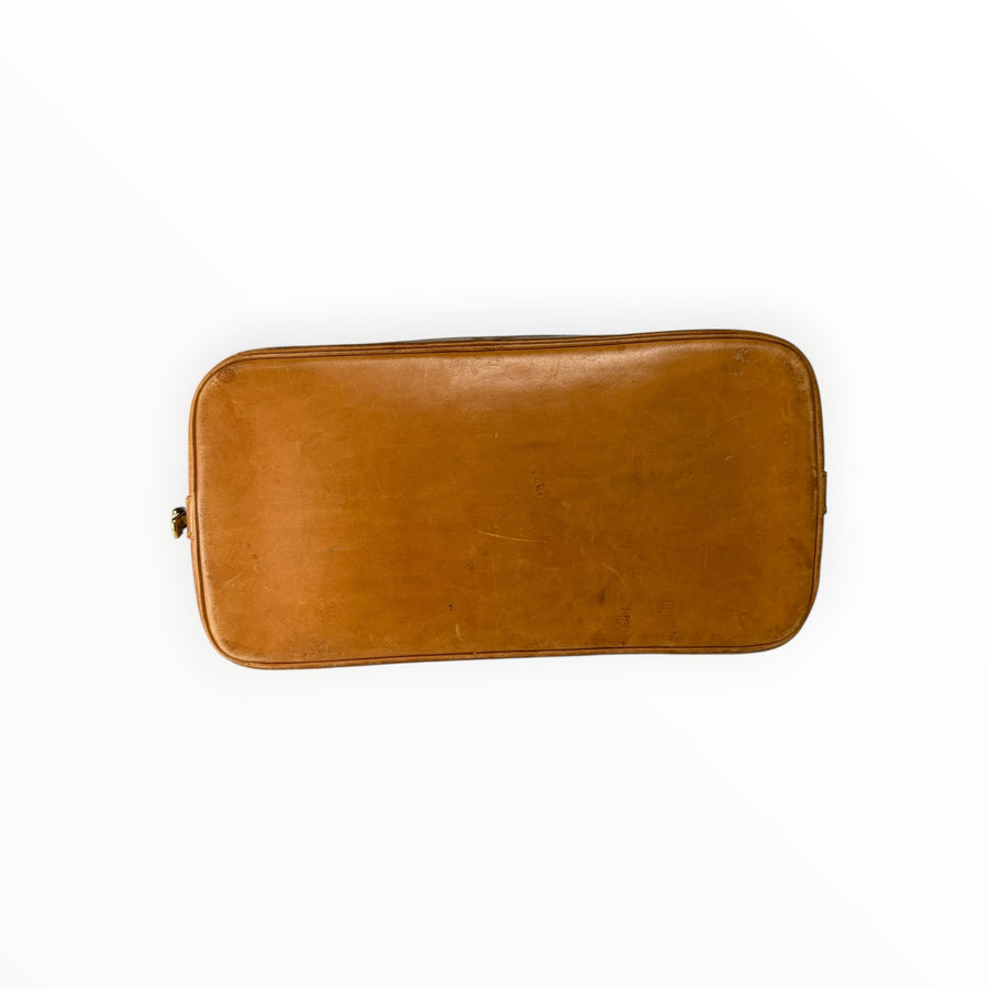 Base en cuir de vachette naturel du sac Louis Vuitton Alma Secondstore montrant la patine authentique