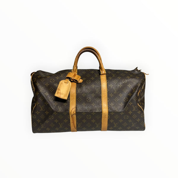 Sac de voyage Secondstore Louis Vuitton Keepall en toile Monogram marron avec finitions en cuir de vachette naturel.