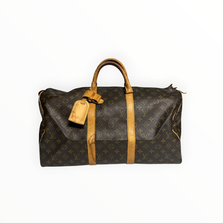 Sac de voyage Secondstore Louis Vuitton Keepall en toile Monogram marron avec finitions en cuir de vachette naturel.