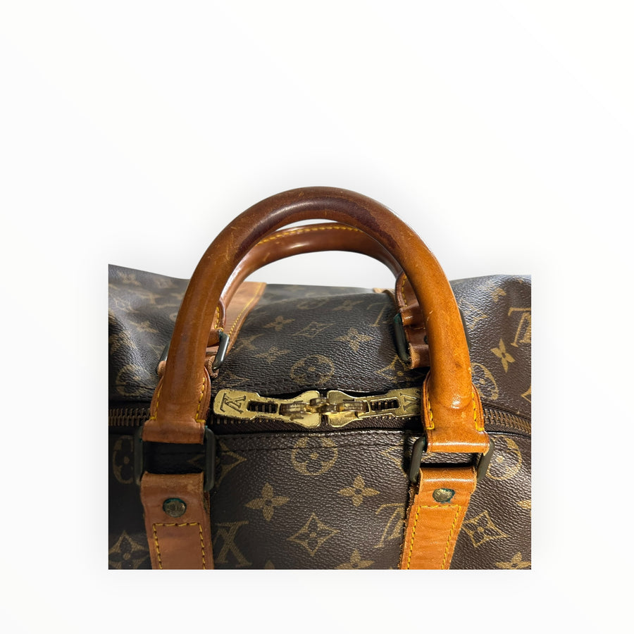 Sac de voyage Secondstore Louis Vuitton en toile Monogram avec poignées en cuir patiné et détails en métal doré