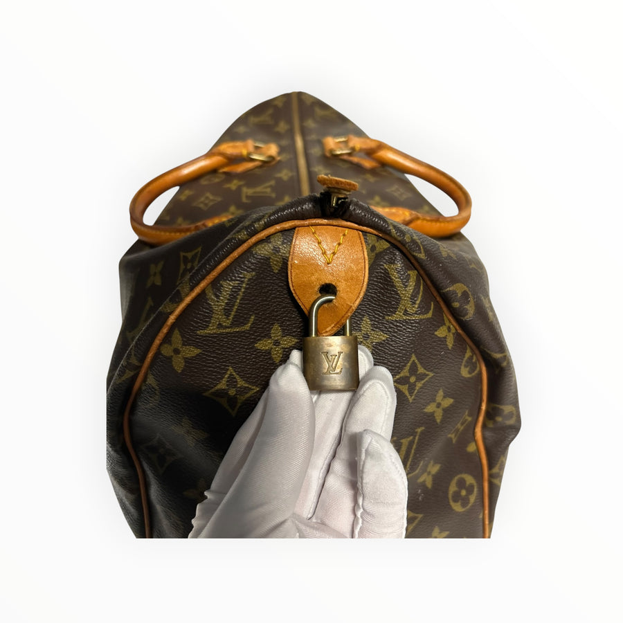 Sac de voyage Secondstore Louis Vuitton Speedy en toile Monogram avec cadenas doré et anses en cuir naturel