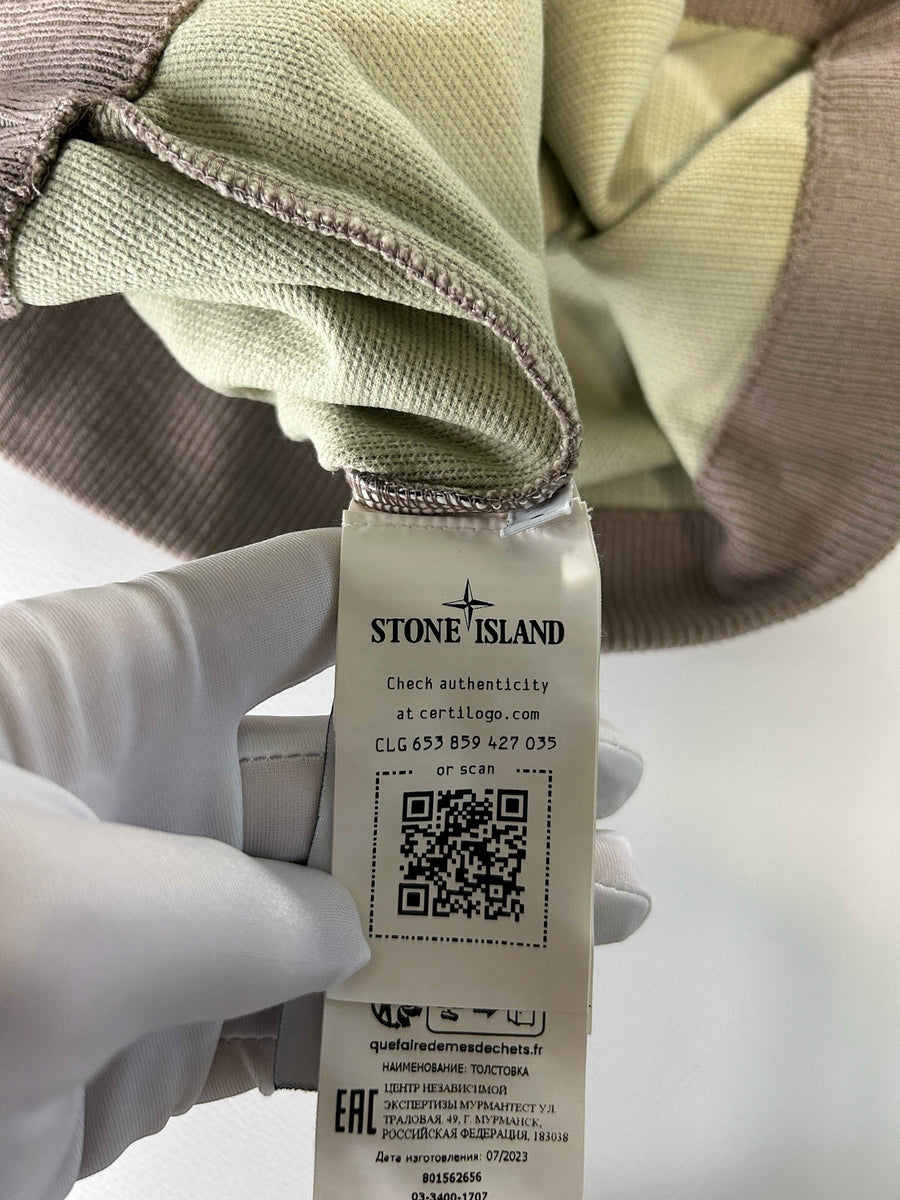 Secondstore Stone Island sweater interior label with authenticity QR code and garment details