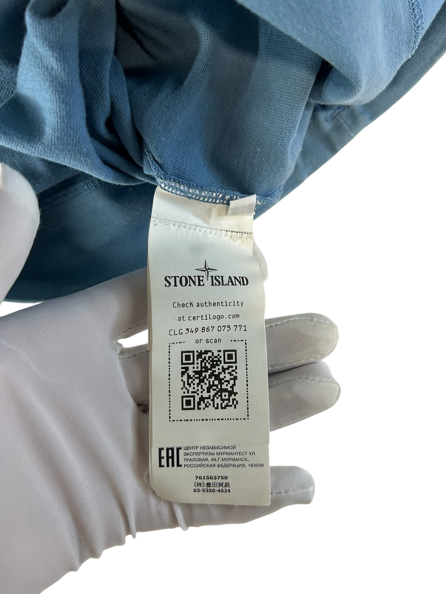 Secondstore Stone Island crewneck sweatshirt authenticity label with QR code and Certilogo details on blue fabric
