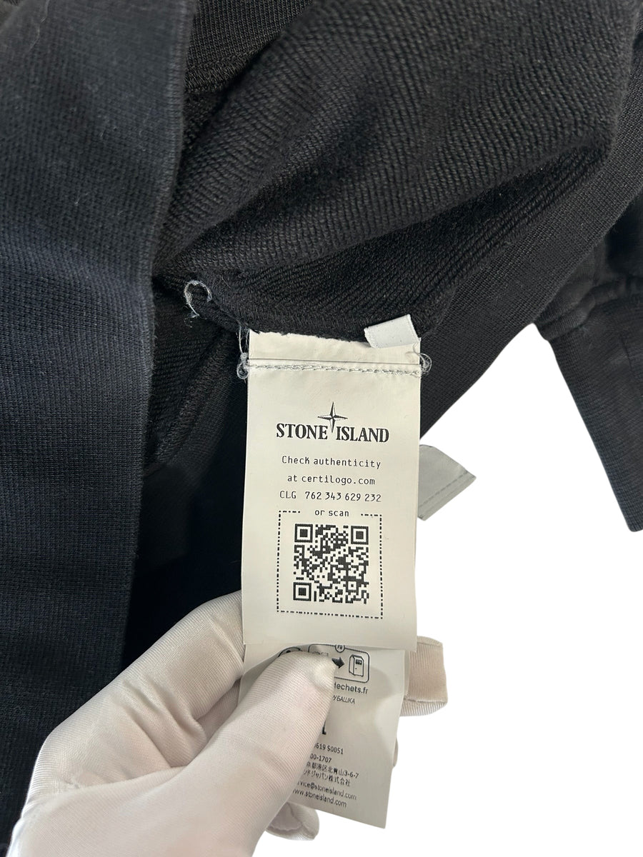 Secondstore Stone Island sweatshirt interior label with authenticity QR code and CLG number on black cotton fabric