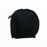 Back view of a black Secondstore Stone Island cotton crewneck sweatshirt with signature compass patch on the sleeve.