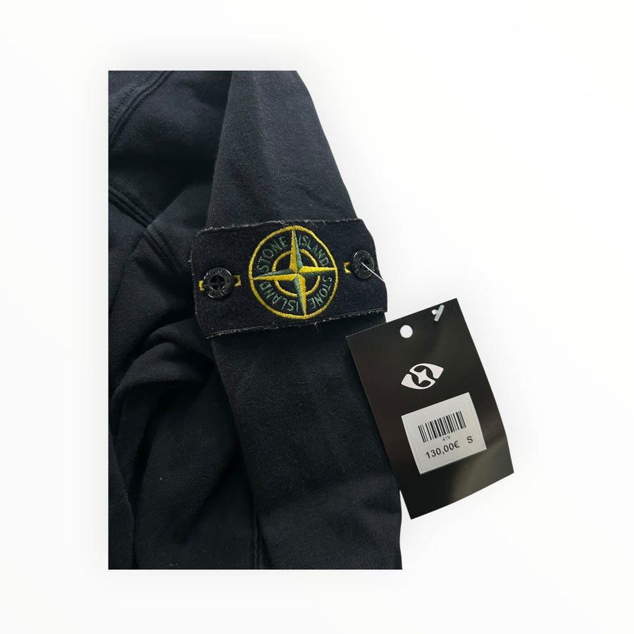 Secondstore black Stone Island crewneck sweatshirt sleeve with iconic yellow and green compass patch and price tag