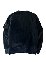 Back view of a black Secondstore Stone Island crewneck sweatshirt in premium cotton with ribbed cuffs and hem.