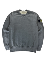Secondstore Stone Island charcoal grey cotton crewneck sweatshirt with iconic compass sleeve patch and V-insert detail.