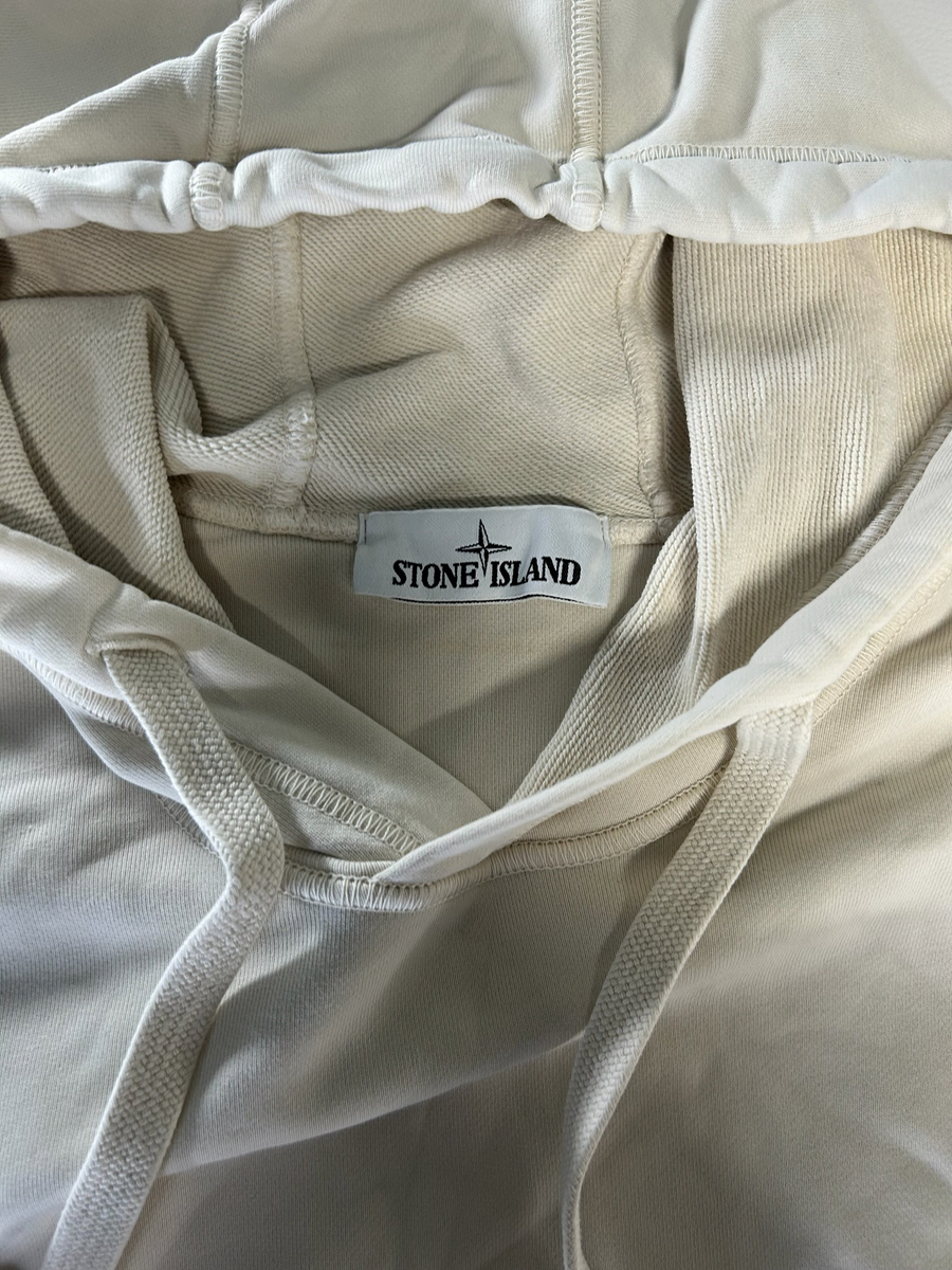 Secondstore Stone Island cream cotton hooded sweatshirt featuring a branded neck label and adjustable drawstring hood.
