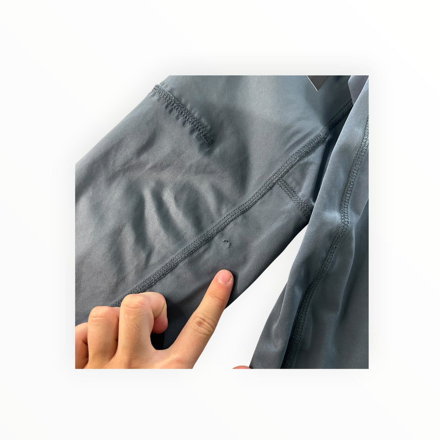 Secondstore Stone Island grey soft shell jacket sleeve showing a small fabric defect point
