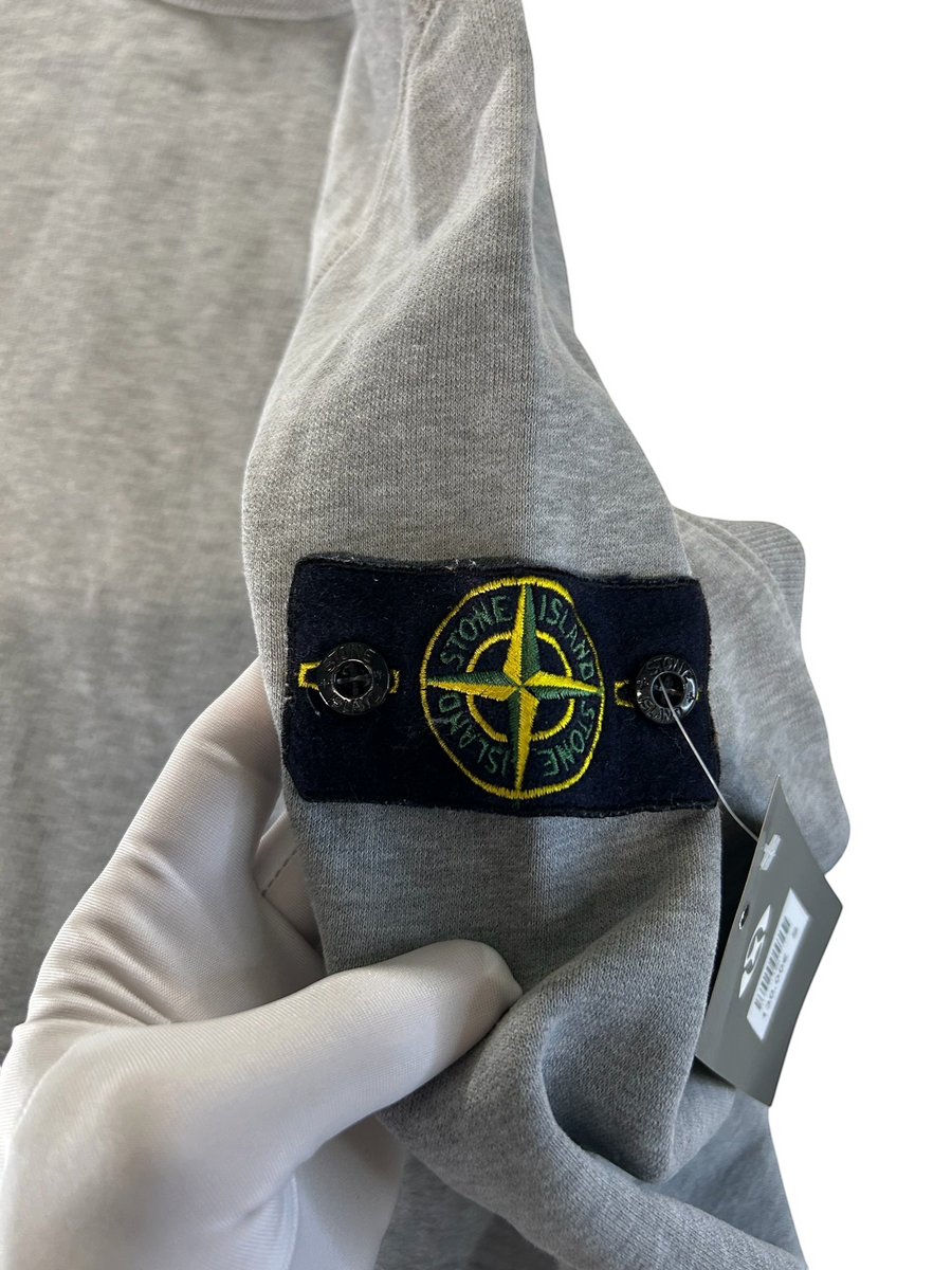Secondstore grey cotton fleece sweatshirt featuring the iconic detachable Stone Island compass patch on the sleeve.