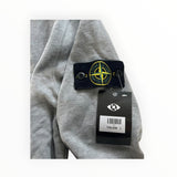 Secondstore Stone Island grey cotton sweatshirt sleeve with iconic embroidered compass patch and retail price tag