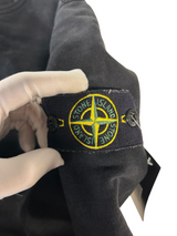 Secondstore black Stone Island crewneck sweatshirt sleeve featuring the iconic embroidered compass logo patch