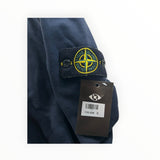 Secondstore navy blue Stone Island crewneck sweatshirt sleeve with iconic yellow and green compass patch and price tag
