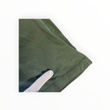 Secondstore Stone Island olive green cotton t-shirt showing a small fabric imperfection near the hem