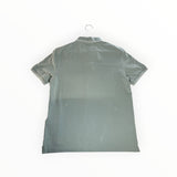 Back view of a sage green Secondstore Stone Island cotton pique polo shirt with contrast tipping on collar and sleeves.