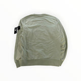 Back view of a sage green Secondstore Stone Island crewneck sweatshirt in soft cotton with a sleeve compass badge.
