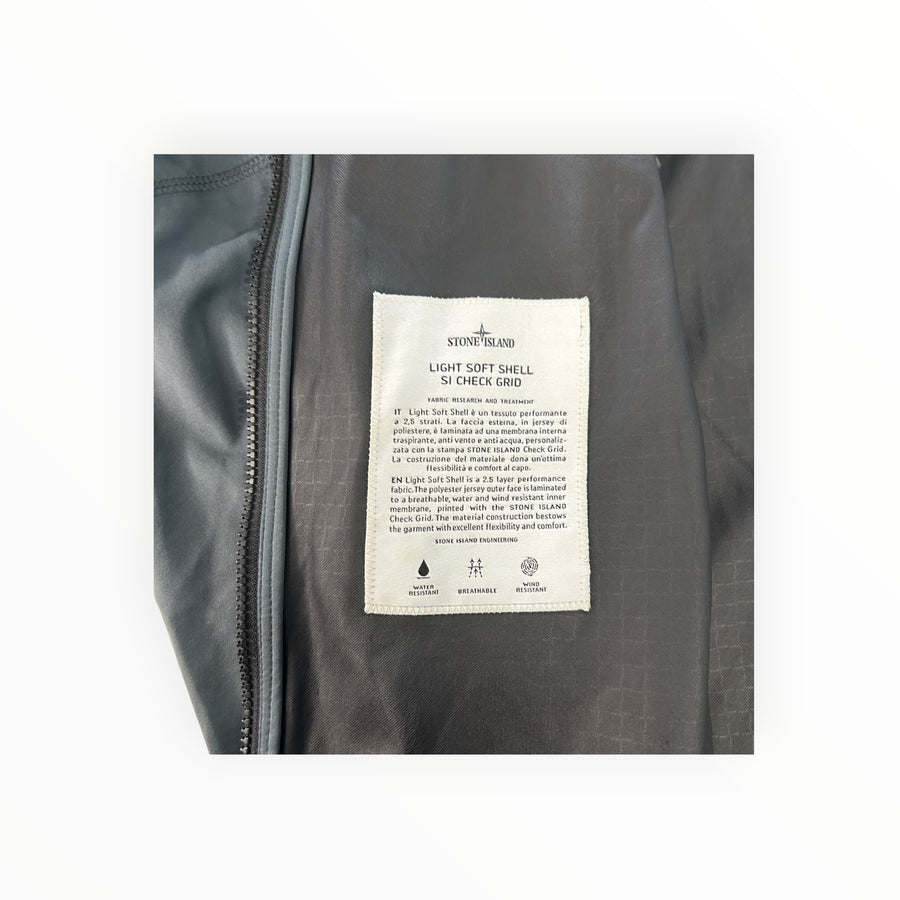 Secondstore Stone Island Light Soft Shell jacket interior label with Check Grid print and technical specifications