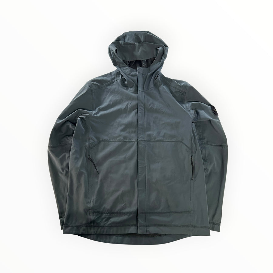 Secondstore Stone Island light soft shell hooded jacket in dark grey with signature compass badge and zip pockets.
