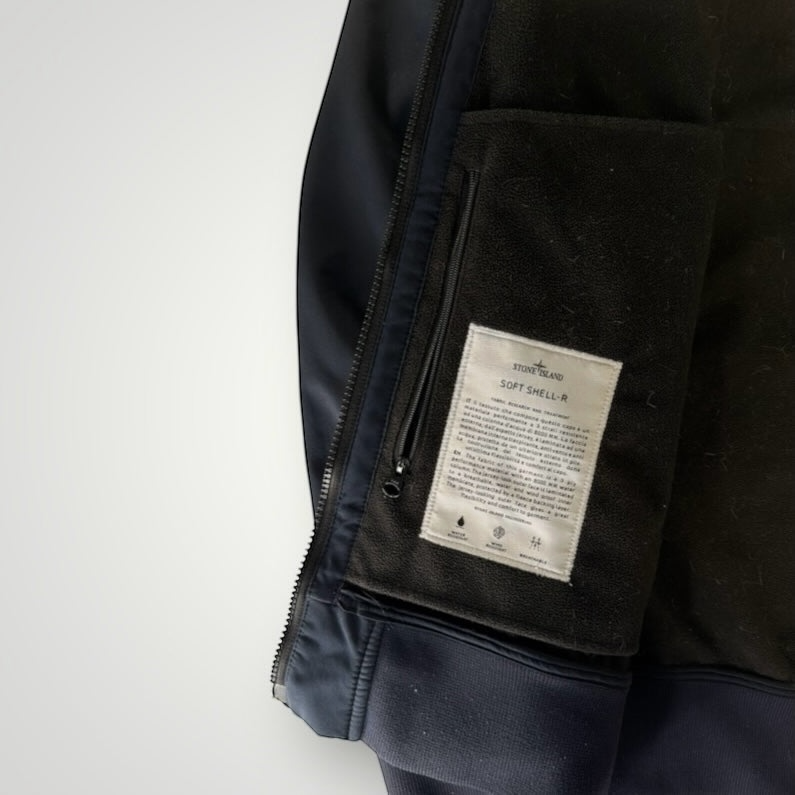 Secondstore Stone Island Soft Shell-R jacket interior showing the technical fabric label and soft fleece lining