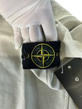 Secondstore Stone Island crewneck sweatshirt in light grey cotton featuring the iconic removable compass sleeve badge.