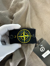 Secondstore taupe Stone Island ribbed crewneck sweater featuring the iconic compass patch on the sleeve