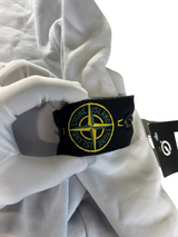 Secondstore white Stone Island crewneck sweatshirt featuring the iconic compass patch on the sleeve