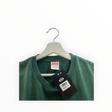 Secondstore forest green Supreme cotton t-shirt with crew neck and original brand label on a white hanger